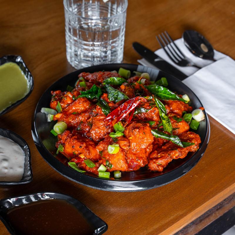 Mint and Martini signature dishes Lamb Seekh KebabPaneer Tikka SkewersMasala Jackfruit Tacos